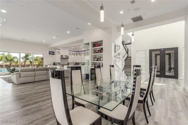 dining area featuring french doors, visible vents, recessed lighting, and light wood-type flooring