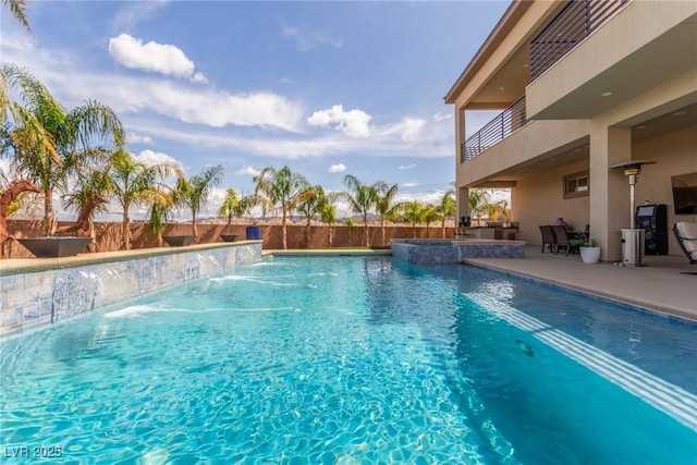 view of swimming pool with a patio, a fenced in pool, and a fenced backyard