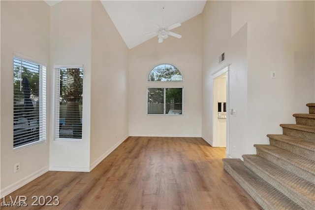 entrance foyer with plenty of natural light, wood finished floors, visible vents, and ceiling fan