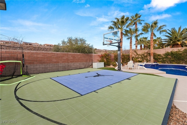 view of sport court with a fenced in pool, basketball hoop, and fence