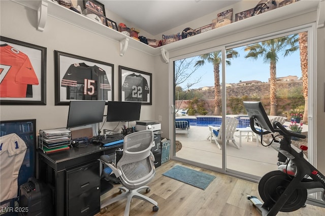 office space with a healthy amount of sunlight and wood finished floors