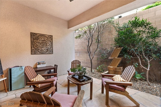 view of patio / terrace featuring fence