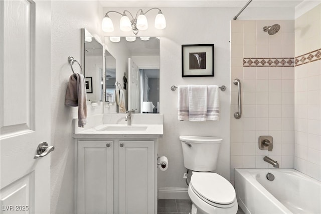 bathroom featuring bathing tub / shower combination, baseboards, toilet, and vanity