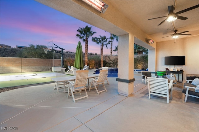 view of patio featuring an outdoor living space, outdoor dining area, a ceiling fan, and fence