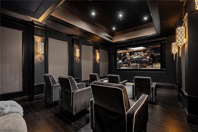 cinema featuring crown molding, a decorative wall, recessed lighting, and dark wood-style floors