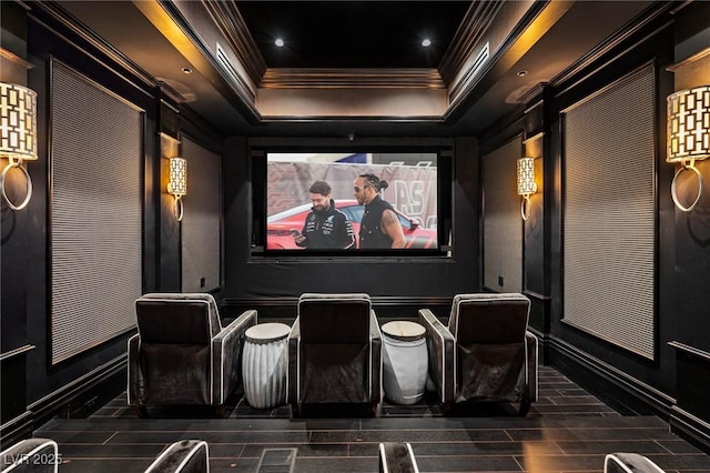 home theater featuring a barn door, recessed lighting, and ornamental molding