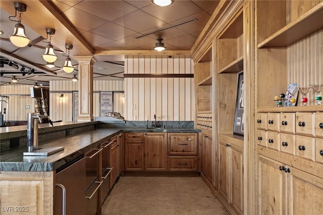 64 Promontory Ridge Dr, Las Vegas, NV 89135 - kitchen with decorative columns, a sink, hanging light fixtures, a peninsula, and open shelves