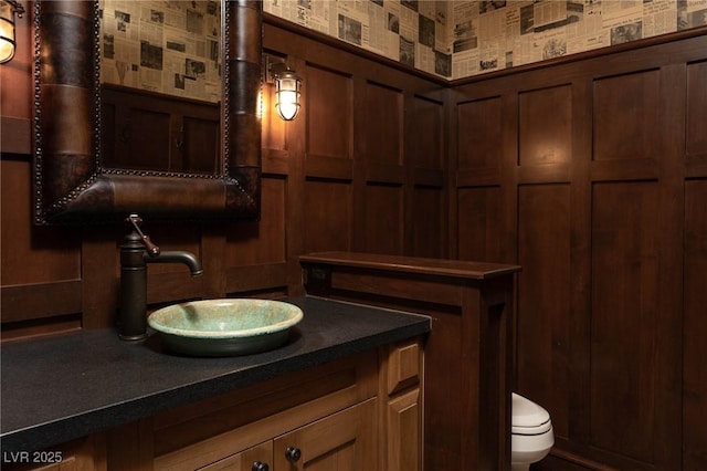 bathroom with vanity and toilet