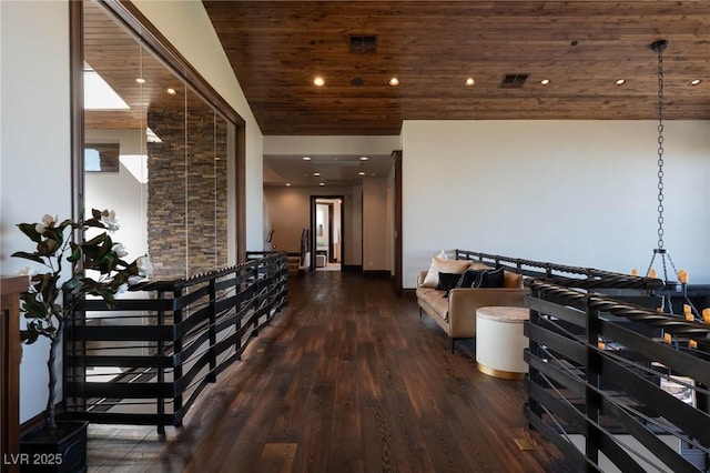 corridor with wood finished floors, wood ceiling, visible vents, and lofted ceiling