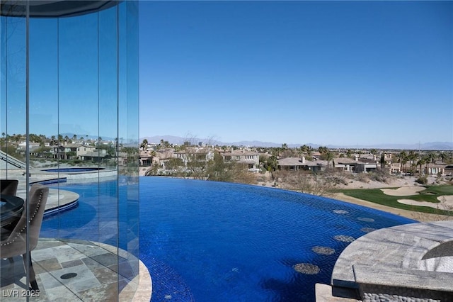 view of pool featuring a residential view