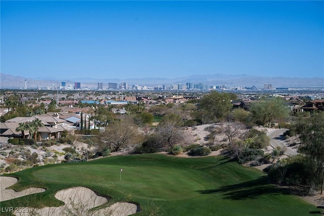 view of home's community featuring a city view, golf course view, and a mountain view