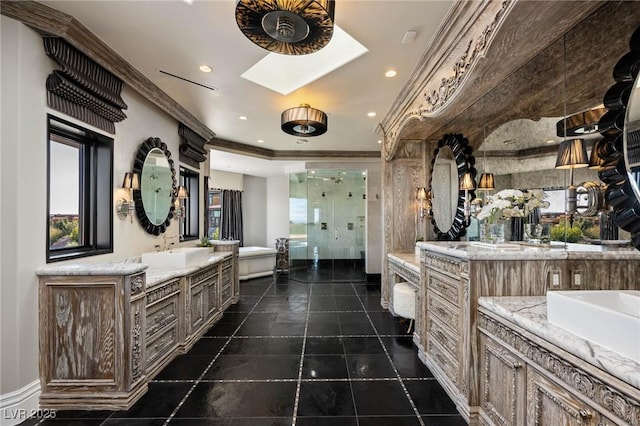 full bath featuring a shower stall, crown molding, two vanities, a freestanding tub, and a sink