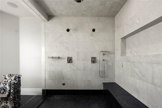 full bathroom featuring tiled shower