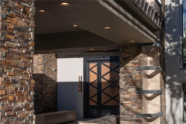 entrance to property with stone siding