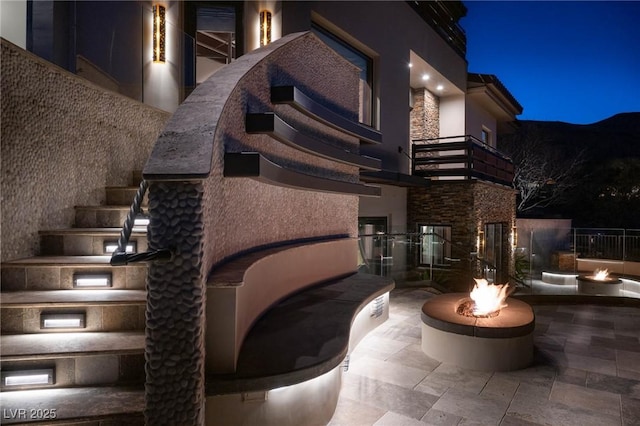 patio at night with an outdoor fire pit