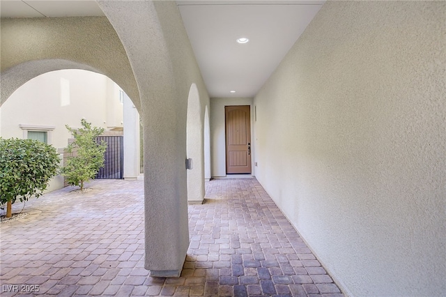 hall with arched walkways