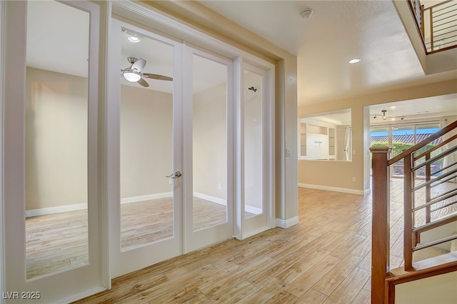 interior space featuring stairway, recessed lighting, light wood-style floors, and baseboards