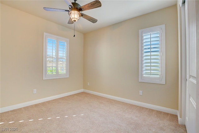 unfurnished room featuring a ceiling fan, baseboards, and carpet floors