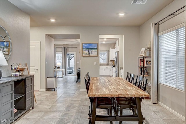 dining space featuring light tile patterned floors, visible vents, recessed lighting, and baseboards