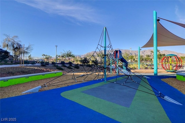 community jungle gym with a mountain view