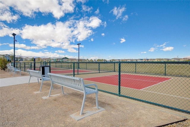 view of sport court with fence