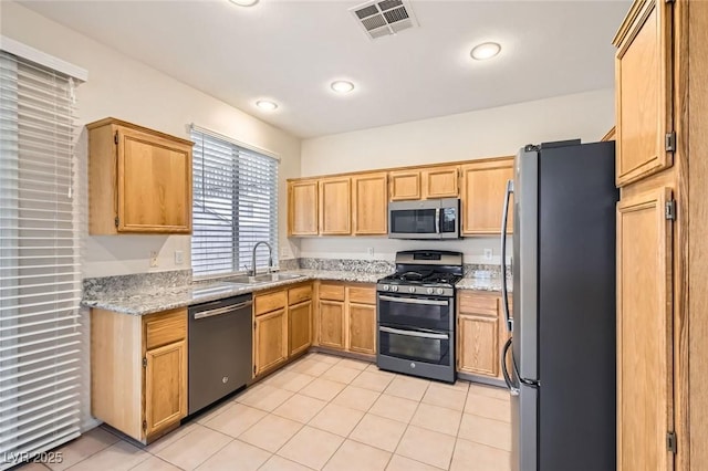 kitchen featuring a sink, visible vents, appliances with stainless steel finishes, and light tile patterned floors