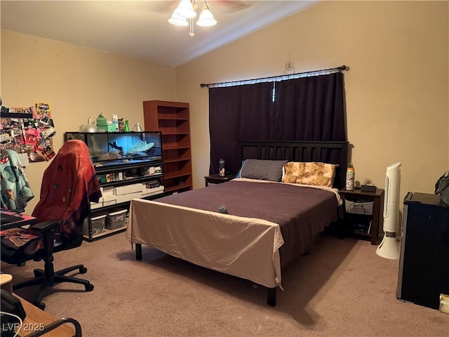 bedroom featuring light colored carpet, a ceiling fan, and vaulted ceiling