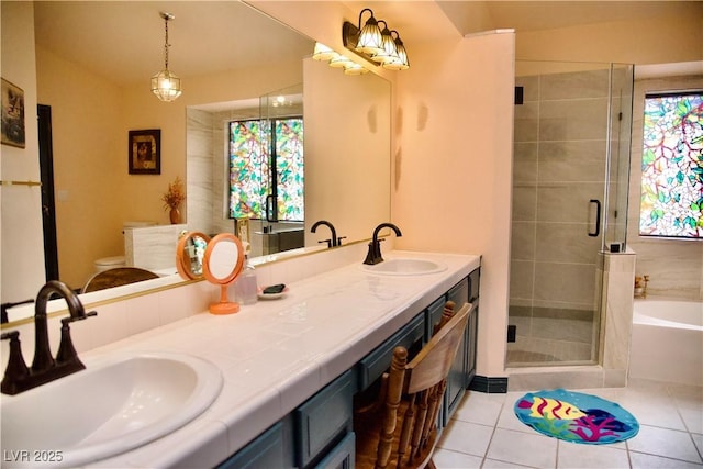 full bath featuring a sink, plenty of natural light, and a stall shower