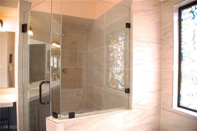 bathroom with vanity and a stall shower