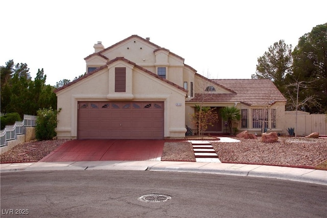 mediterranean / spanish house with an attached garage, a tiled roof, stucco siding, a chimney, and driveway