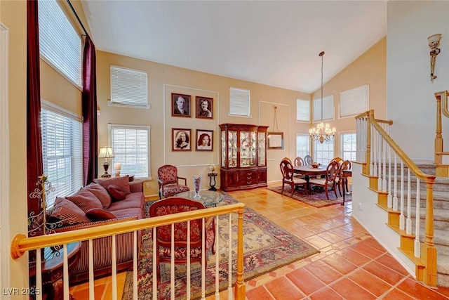 tiled living area featuring stairway, high vaulted ceiling, and a chandelier