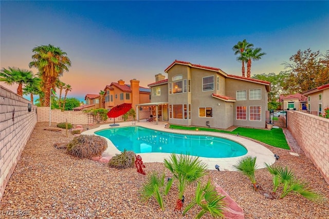 view of pool with a patio area, a fenced backyard, and a fenced in pool