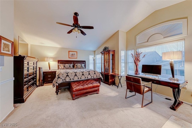 bedroom with light colored carpet, baseboards, lofted ceiling, and ceiling fan