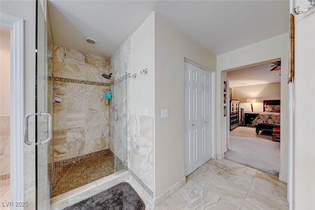 bathroom with baseboards, ensuite bath, marble finish floor, and a stall shower