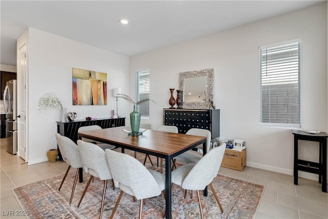 dining room featuring light tile patterned floors, recessed lighting, and baseboards