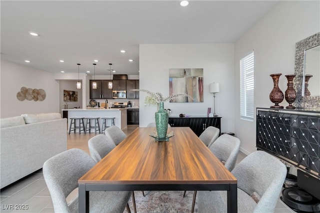 dining room featuring light tile patterned floors and recessed lighting