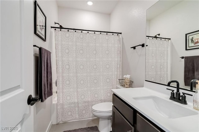 bathroom with shower / tub combo with curtain, toilet, and vanity