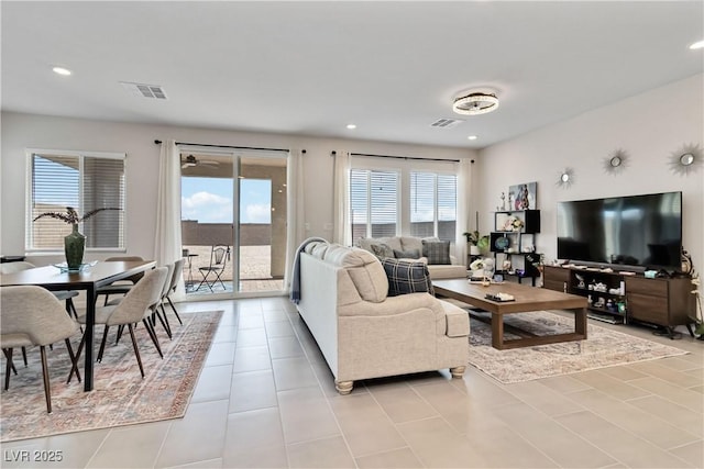 living room featuring recessed lighting, visible vents, and light tile patterned flooring