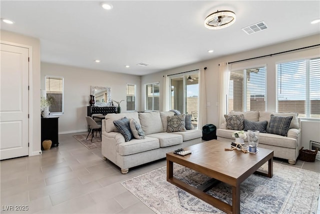 living room with light tile patterned flooring, recessed lighting, and visible vents