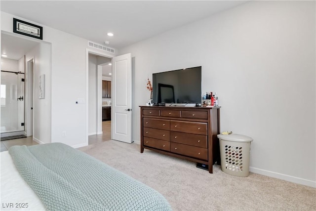 bedroom with visible vents, recessed lighting, connected bathroom, baseboards, and light colored carpet