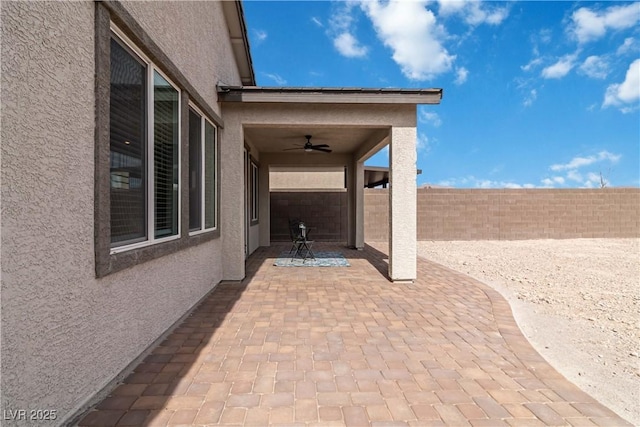 view of patio / terrace featuring a fenced backyard and a ceiling fan