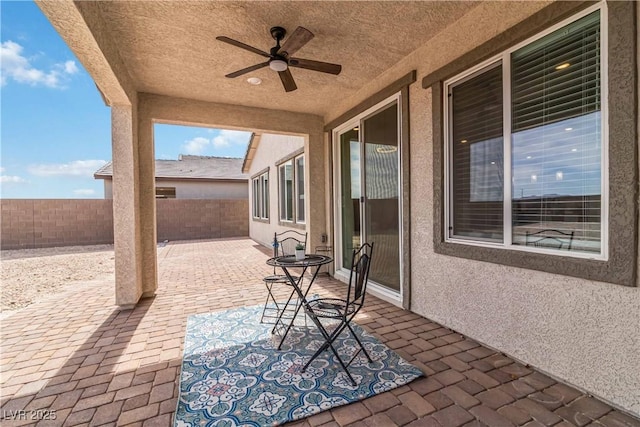 view of patio featuring a fenced backyard and ceiling fan