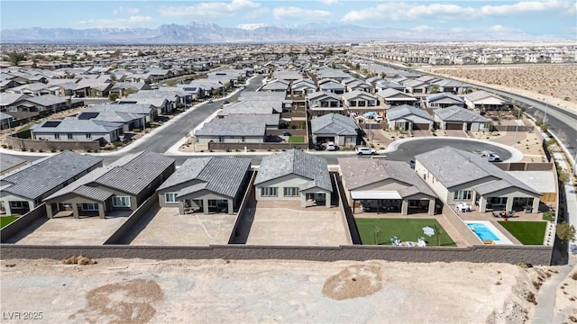 birds eye view of property featuring a mountain view and a residential view