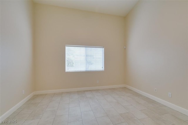 empty room featuring baseboards