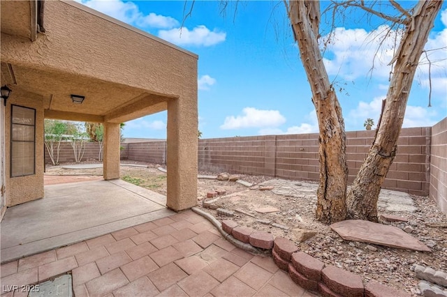 view of patio featuring a fenced backyard