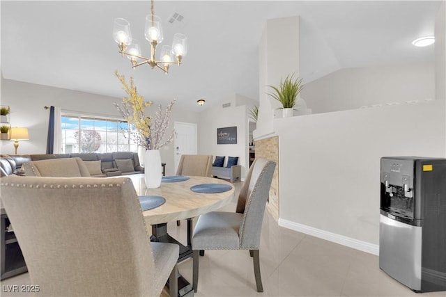 dining area featuring visible vents, baseboards, lofted ceiling, light tile patterned floors, and a notable chandelier