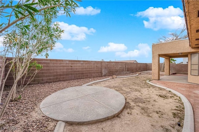 view of yard with a patio and a fenced backyard