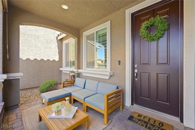 property entrance with stucco siding