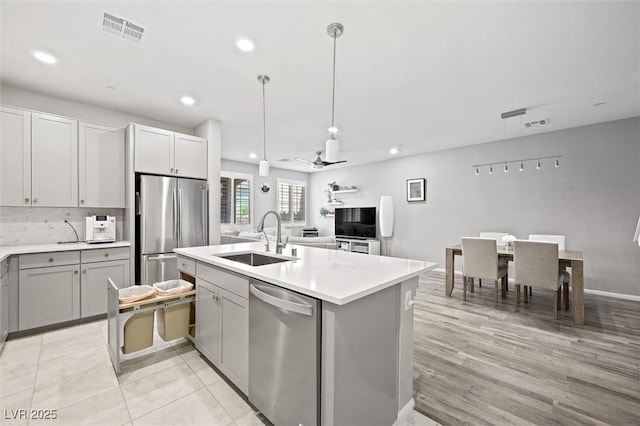 kitchen with visible vents, a sink, recessed lighting, stainless steel appliances, and light countertops