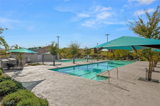 community pool with a patio